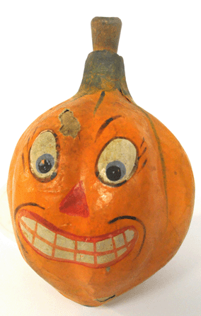 A scarce papier mache gourd-form horn with painted pumpkin face.