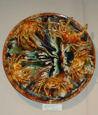 A crab platter in the Palissy style was a standout in Solebury, Penn., dealer Charles L. Washburne's booth. Made around 1880 at Pinheiro in Caldas da Rainha the platter is remarkable for its detailing and the oceanic swirl of glazes in which five crabs swim.