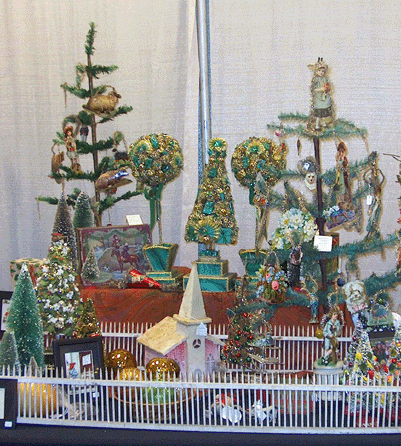 Munday and Munday Antiques, Benton, Ill., a mother-daughter team, offered Christmas shoppers Nineteenth Century Christmas decorations and early feather trees.