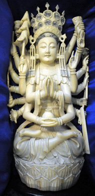 The 14-inch-tall figural carved ivory bodhisattva sold at $5,581.