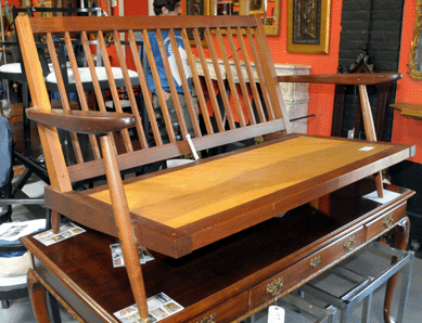 Midcentury items did well, with a Nakashima spindle-backed settee realizing $2,937.