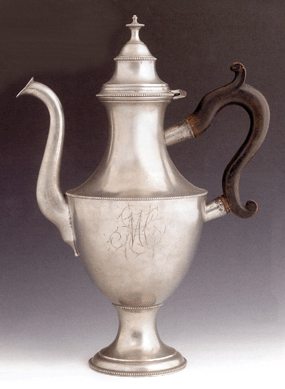This important Philadelphia pewter coffeepot, attributed to William Will, circa 1775, with a scrolled treen handle, beaded bands and gooseneck spout, the body with engraved monogram "MC,†15¾ inches tall, had a $40/80,000 estimate and sold for $45,030 to Melvyn and Bette Wolf, dealers from Flint, Mich.