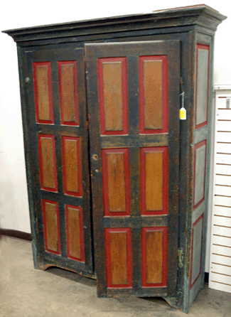 With blue and red painted door panels, as well as side panels, this cupboard, either American or Canadian, sold for $1,652.