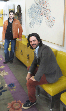 Michael, foreground, and Mark Millea with the studded yellow lacquer sideboard by Tommi Parzinger, circa 1970, that finished at $16,800.