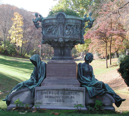 The stolen bronze statue among a grouping situated at the entrance to the cemetery, is the figure of death at left. The group includes a central "Elephant Vase†flanked on either side by figures representing death and hope in the afterlife. The urn is decorated by a frieze of four raised panels, each depicting an event in the life of Christ. The sculpture, circa 1830s-40s, is by Connecticut-born sculptor George Edwin Bissell (1839 †1920). Daniel M. Lynch photo.