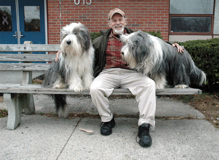 Arriving several hours before the opening of an antiques show, bearded collies Winston and Willoughby await the opening with owner Scott Cook. The dogs are as much a presence on the antiques trail as they are in "their†gardens and throughout "their†house. ⁁ntiques and The Arts Photo, R. Scudder Smith