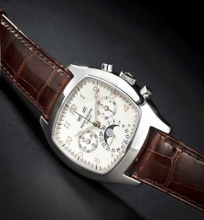 This Patek Philippe Ref 5020P rare platinum cushion-form perpetual calendar chronograph wristwatch with registers and moon phases and a spare diamond-set black dial, circa 1996, achieved a world auction record price of $338,500.