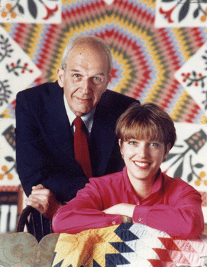 Morris Finkel and Amy Finkel in front of a quilt circa 1989.