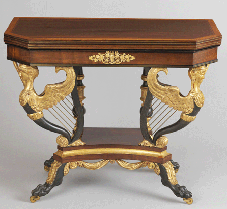 The rosewood card table in amboyna veneers, rosewood-grained maple, gilded gesso and vert antique and gilded brass is attributed to Duncan Phyfe and was made with winged caryatids supporting harps on their backs. Collection of Mr and Mrs Joseph Allen. ⁂ruce Schwarz, Metropolitan Museum of Art photo