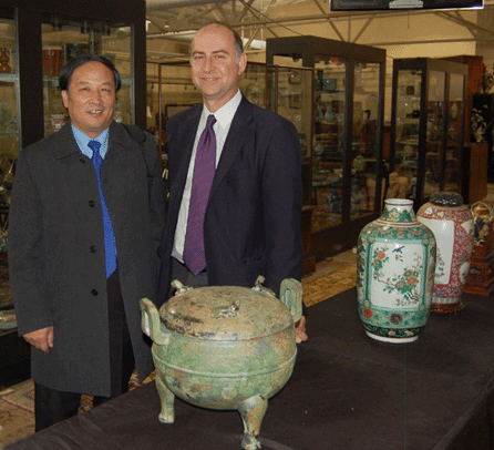 Benjamin Y. Wang, Asian department director, is shown at left with auctioneer Frank Kaminski.