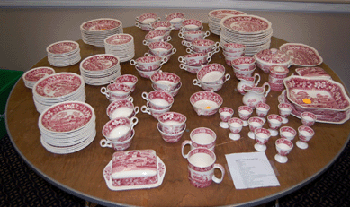 One of two large tables of Spode Pink Tower pottery sold in small lots for a total of $3,042.