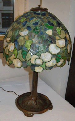 Marked "Tiffany Studios, New York 351,†a Snowball table lamp on a bronze base sold for $11,850.