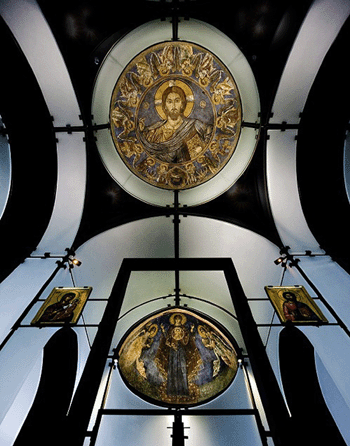 This interior view of the Byzantine Fresco Chapel captures the restored frescoes in place, one in the apse and the second in the dome. The minimalist environment makes them more powerful. ⁊. Griffis Smith photo 