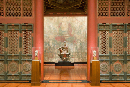 View of the Chinese Temple showing the Twelfth Century polychrome carved wood figure of Guanyin of the Southern Sea in front of the Thirteenth Century mural depicting the Assembly of Tejaprabha.