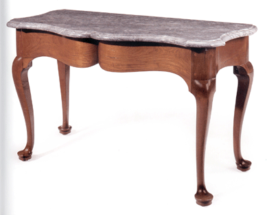 Wallace Nutting included this Queen Anne mahogany marble slab table in volume three of his Furniture Treasury. Perhaps the first expression of the serpentine form in America, the rare example went to dealer G.W. Samaha on behalf of a collector for $2,098,500. Made in 1755, it is accompanied by its original bill of sale from Newport, R.I., cabinetmaker John Goddard to Captain Anthony Low of Warwick, R.I. From the collection of Mr and Mrs Joseph K. Ott, the Otts acquired the table from Ansonia, Conn., dealer Harry Arons.