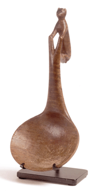 Top honors in the Brams collection of Woodlands Indian art went to this unique figured-maple ladle with a handle representing a stylized lynx. From the Great Lakes and dating to around 1780, it surpassed its  $30/50,000 estimate to bring $89,900. The price was a record at auction for a Native American ladle.