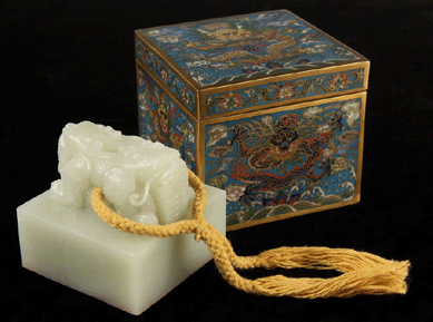 Leading Asian arts was this large Chinese jade seal in a custom-fitted, Nineteenth Century cloisonné box with dragons on every side that took $37,950. The jade seal is surmounted by a double-headed dragon pierced to receive silk cord.