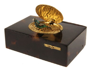 Proving that smalls often bring big money was this miniature mechanical music box from renowned watchmaker Patek Philippe that attained $40,250. The tortoiseshell and gold music box with key and mechanical bird having real iridescent feathers measures 3¾ by 2½ by 1½ inches and came in its original fitted box.