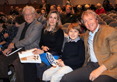 As Sotheby's American Furniture specialist Leslie Keno took bids, his family cheered him on. In the front row, from left, were his father, Ron Keno; Leslie's wife Emily; his son Schuyler; and his brother Leigh. The youngest bidder in the room, Schuyler Keno purchased two hat boxes, $3,125, and two English transfer-printed creamware jugs commemorating George Washington, $3,125. Both lots were from the collection of Betty Ring. Leigh Keno underbid the signed John Townsend high chest that fetched $3,554,500.