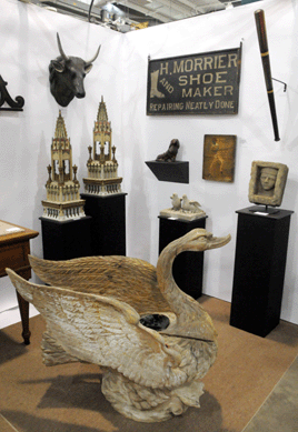 The carved wooden swan flew out of the booth of Otto & Susan Hart, Arlington, Vt.