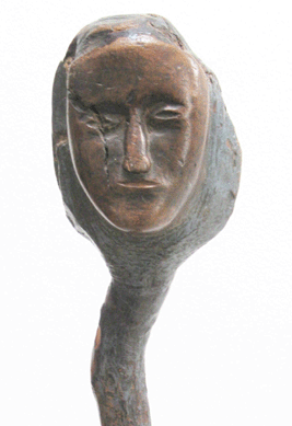 The striking face at the top of this walking stick is attributed to a Native American and carved from a branch and burl. Attributed to Eastern Woodland, late Nineteenth Century.