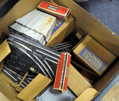 Three different boxes of Lionel trains sold at $111, $132 and $176.