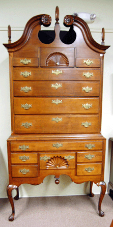 The New England Chippendale cherry highboy brought $43,290 from a collector.