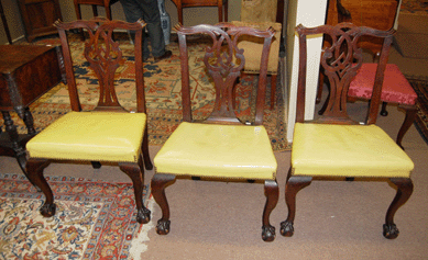 A set of six Salem Chippendale mahogany side chairs, circa 1780, sold for $36,970. Whether their lemon yellow Naugahyde upholstery helped or hindered the price is unknown.