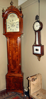 The Concord, Mass., tall clock by Daniel Munroe sold for $21,060, and the Simon Willard Federal banjo clock brought $23,400.