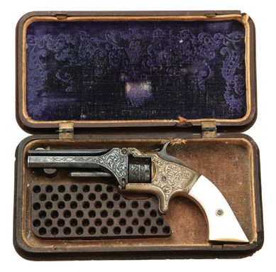Engraved brass frames and mother of pearl grips contributed to the $9,400 price of this cased Smith & Wesson Model No. 1 revolver. Sold by a phone bid to a member of the trade, the seven-shot example came in its original gutta percha case.