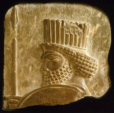 Assyrian low relief sandstone, approximately 8 by 8 by 1 inch