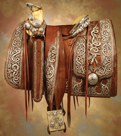 This rare, historic, silver embroidered saddle once belonged to the infamous renegade and revolutionary hero Pancho Villa. Prior to Villa's assassination in 1923, the saddle was created for him by Mexican artisans and presented to him. Smothered in silver-wrapped threads over leather stump work with boldly-domed silver conchos, the saddle was offered without reserve, and after fierce bidding it sold for $718,00 †a new world record for a saddle at auction.