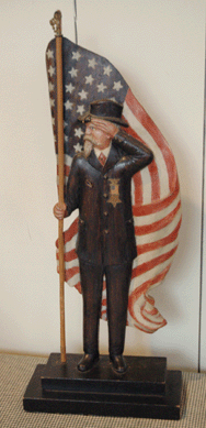 Holman Waldron Chaloner carved this figure, a bearded man with top hat, holding an American flag. It dates to World War II and was used as the cover illustration on Bob Levine's last book, Resurrecting Democracy †A Citizen's Call for a Centrist Third Party.