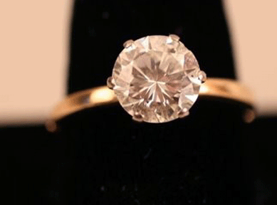 A 14K yellow gold diamond engagement ring with a 2.5-carat round, brilliant-cut diamond sold for $15,600. 