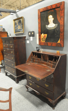 A New Hampshire desk with robust bandy legs in the booth of Peter Eaton and Joan Brownstein, Newbury, Mass.