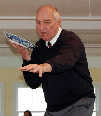 Michael Corcoran sells a Chinese blue and white porcelain dish with an imperial five-clawed dragon decoration to the trade for $11,400.