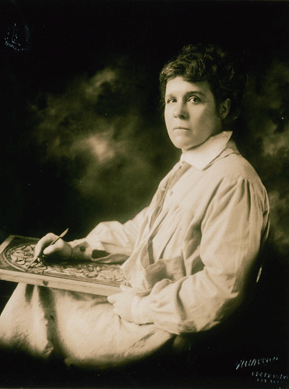 Marie Zimmermann in a circa 1924 photograph is engaged in modeling in wax the memorial doors for the mausoleum of A. Montgomery Ward and his business partner and brother-in-law George R. Thorne.