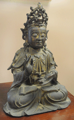 The early Chinese bronze figure of a seated Buddha, $3/5,000, attracted a lot of interest, selling to an Internet bidder at $40,800.