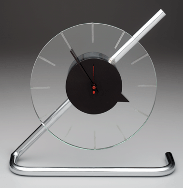Showing dynamic use of materials and technology, Gilbert Rohde (American, 1894‱944) created this Z clock for the Herman Miller Clock Company, Zeeland, Mich., in 1933. Replacing a traditional clock case with glass, enamel and chromium-plated steel, he echoed the streamlined look popular at the time and lowered production costs; 11¾ by 12 by 3 inches. The clock was exhibited at A Century of Progress International Exposition in Chicago, 1933″4. Dallas Museum of Art. 