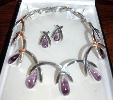 White Orchid Antiques, Media, Penn., brought this elegant 1950s Antonia Pineda set featuring a sterling silver and amethyst necklace and earrings in a classical Modernist design. 