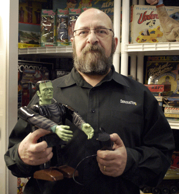 Tom Miano of Serious Toyz, Croton-on-Hudson, N.Y., holds up a Marx Frankenstein battery-op from 1968.