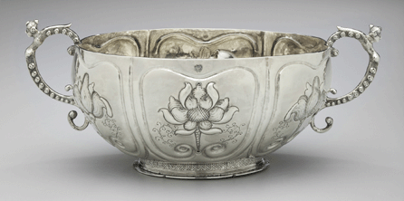This splendid Brandywine bowl, fashioned by silversmith Benjamin Wynkoop around 1700 for the prominent De Peyster family, reflects the predilection for Dutch traditions and fashion in early New York City. Used for celebrations in honor of mothers and newborn children, it was often filled with a potent brew of brandy and raisins. Like many objects in the NYHS silver collection, it was donated by a De Peyster descendant.
