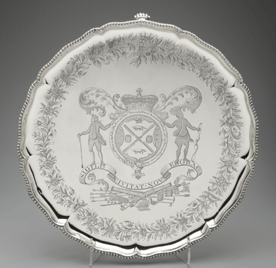 A masterpiece of colonial presentation silver, this grand tray, adorned with the seal of the City of New York, was given by Royal Governor William Tryon to engineer Thomas Sowers in appreciation for overseeing repair of the Battery at the tip of Manhattan, a key defense installation. Massive, durable and valuable, this token of thanks was created by Swiss-born goldsmith Lewis Fueter.