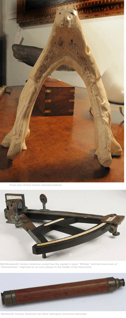 From top to bottom are a frontal view of the Inuit marine mammal jawbone; a mid-Nineteenth Century American octant with the captain⁳ name ⁗thider†and his hometown of ⁂remerhaven†engraved on an ivory plaque in the middle of the instrument; and a Nineteenth Century American two-draw mahogany and brass telescope