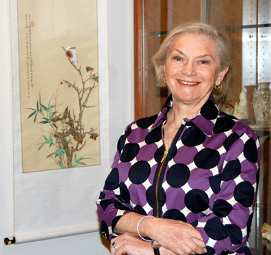 Judith F. Dowling, director of the Asian works of art department at Skinner, is pictured with the hanging scroll attributed to Qi Baishi that sold for $65,175.