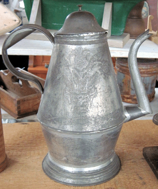 Dave Irons Antiques, Northampton, Penn., offered an early tin coffeepot with tulips as the punched design for $5,500.