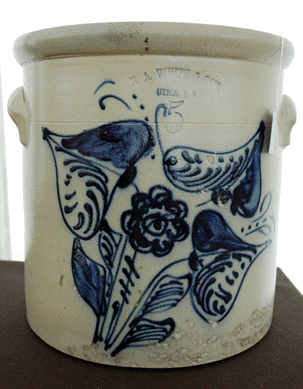 A white Utica 3-gallon crock with cobalt orchid decoration was part of the collection of Jerry Fredette, Bear Hollow Antiques, Williamsburg, Mass.