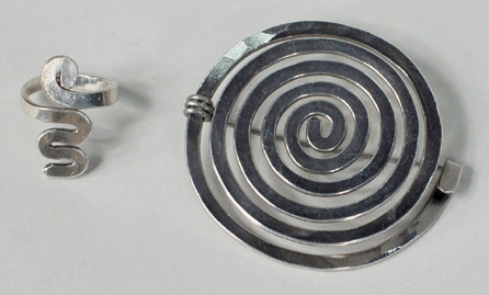 One of the sale's consignments comprised these two original pieces of silver jewelry by renowned local sculptor Alexander Calder (American, 1898‱976) whose workshop was in Roxbury, Conn. The two items, a spiral brooch and a ring, totaled $76,200, but were each won by separate bidders, with the brooch going to England and the ring to New York City.