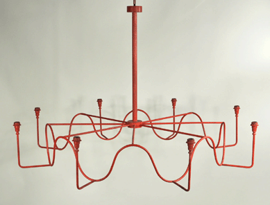 This rare wrought iron circular serpentine chandelier with a 53-inch diameter and attributed to the renowned French designer Jean Royere was part of a group of Midcentury Modern lighting by Royere that also included wrought iron serpentine wall sconces. Together the group brought $57,000, going to the trade.