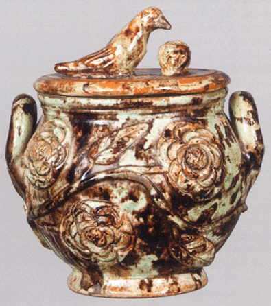 The top lot of the auction, this green-glazed redware sugar bowl with bird finial and attributed to Anthony Weis Baecher, Winchester, Va., realized $47,150 from a Virginia dealer on the phone, believed to be a world auction record for a Shenandoah Valley sugar bowl, and likely the second highest price paid for a Baecher piece of redware.
